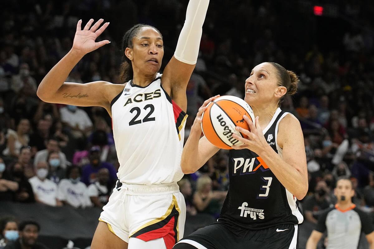 Phoenix Mercury guard Diana Taurasi (3) drives on Las Vegas Aces forward A'ja Wilson (22) durin ...