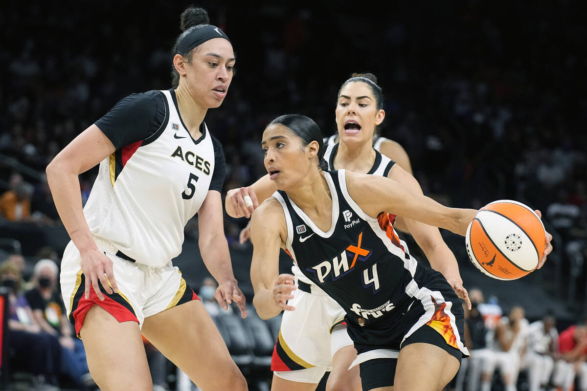 Phoenix Mercury guard Skylar Diggins-Smith (4) drives on Las Vegas Aces forward Dearica Hamby ( ...