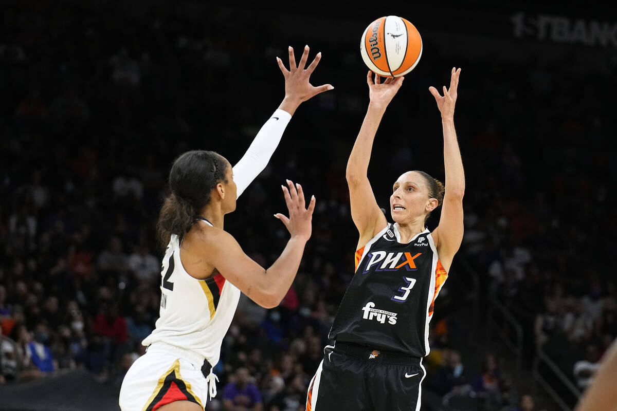 Phoenix Mercury guard Diana Taurasi (3) drives on Las Vegas Aces forward A'ja Wilson (22) durin ...