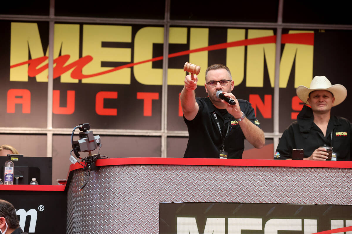 Clint "Col. Clint" Hunter calls on a bidder during Mecum Las Vegas auction at the Las Vegas Con ...