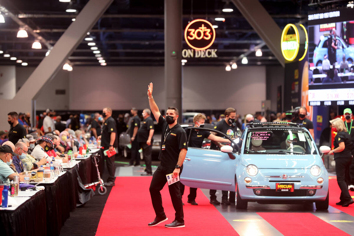 People check out a 2015 Fiat 500 1957 Edition during Mecum Las Vegas auction at the Las Vegas C ...