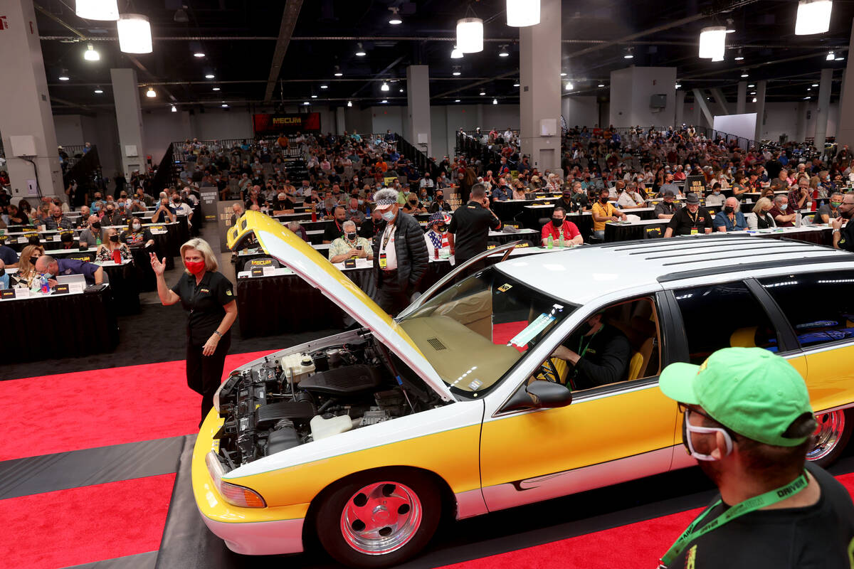 Bidders check out a xxxxx during Mecum Las Vegas auction at the Las Vegas Convention Center Thu ...