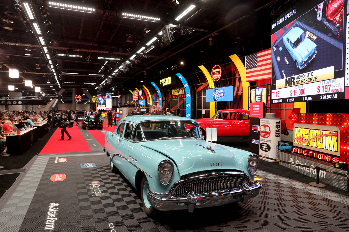 Bidders check out a 1954 Buick Special during Mecum Las Vegas auction at the Las Vegas Conventi ...