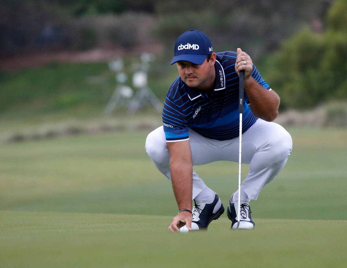 Patrick Reed places a ball on the 10th green during the first round of the Shriners Hospitals f ...
