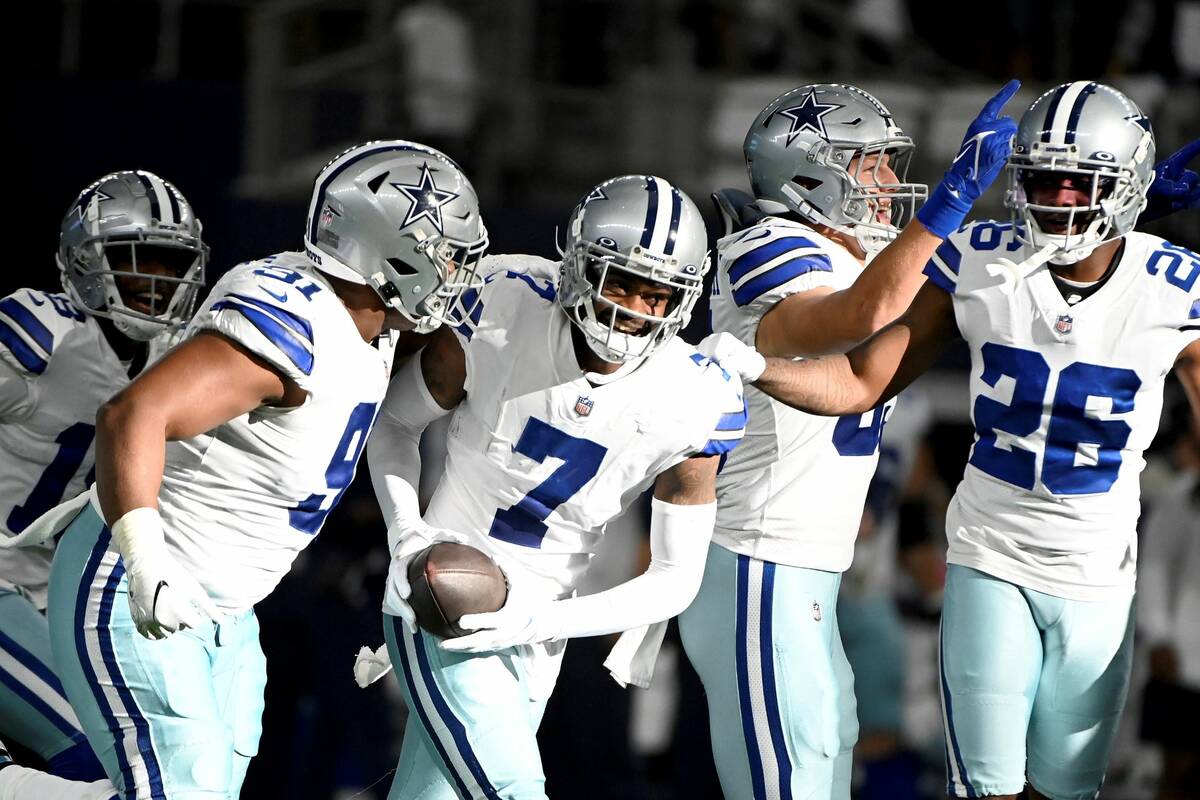 Dallas Cowboys cornerback Trevon Diggs (7) celebrates intercepting a pass with Dallas Cowboys d ...