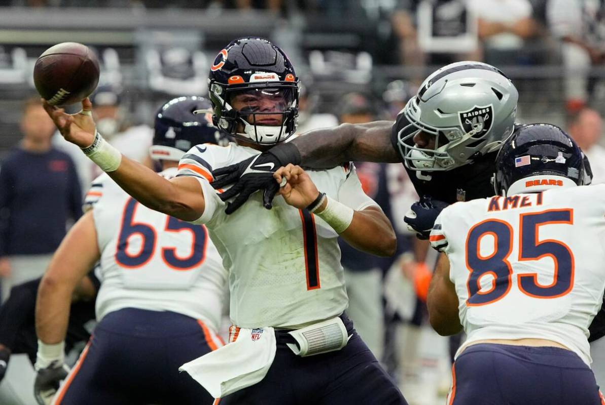 Las Vegas Raiders defensive end Yannick Ngakoue (91) breaks up a pass attempt by Chicago Bears ...