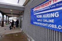 In this Dec. 10, 2020, file photo, a "Now Hiring" sign hangs on the front wall of a Harbor Frei ...