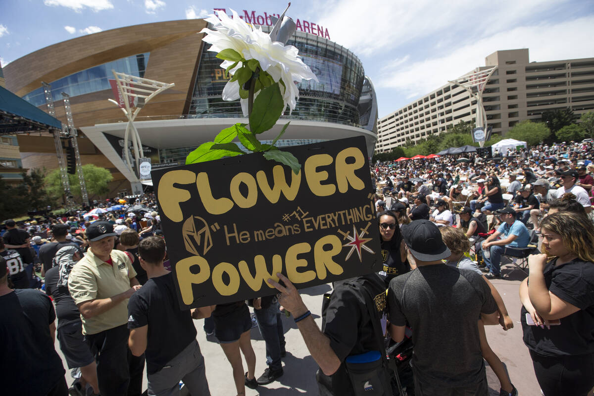 A Golden Knights fan carries a Marc-Andre Fleury sign during a watch party for Game 5 of the We ...