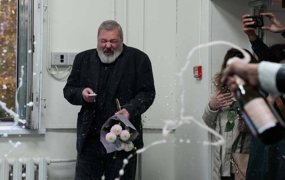 Colleagues pour champaign on Novaya Gazeta editor Dmitry Muratov at the Novaya Gazeta newspaper ...