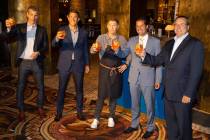 Celebrity chef Bobby Flay, center, with Laurence Kretchmer, from left, managing partner at Bobb ...
