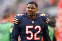 Chicago Bears outside linebacker Khalil Mack (52) smiles as he walks off the field after an NFL ...
