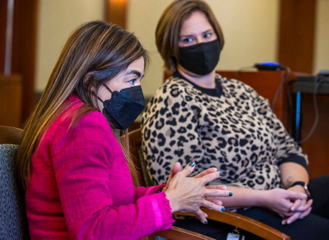 District Judge Bita Yeager, left, and Caitlin Mroz, the mental health court coordinator, talk a ...