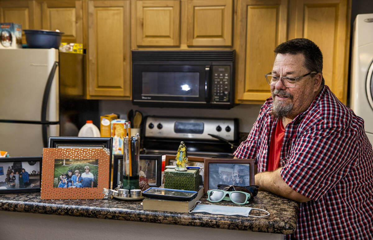 Mental health court graduate Henry Snyder stands in his Bonanza Park Studios apartment on Sept. ...