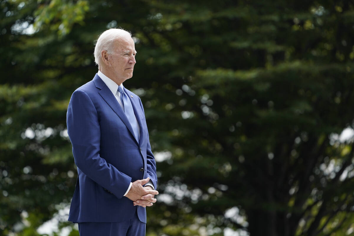 President Joe Biden waits to speak on the North Lawn of the White House in Washington, Friday, ...