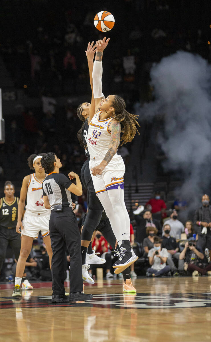 Las Vegas Aces center Liz Cambage (8) and Phoenix Mercury center Brittney Griner (42) fight for ...