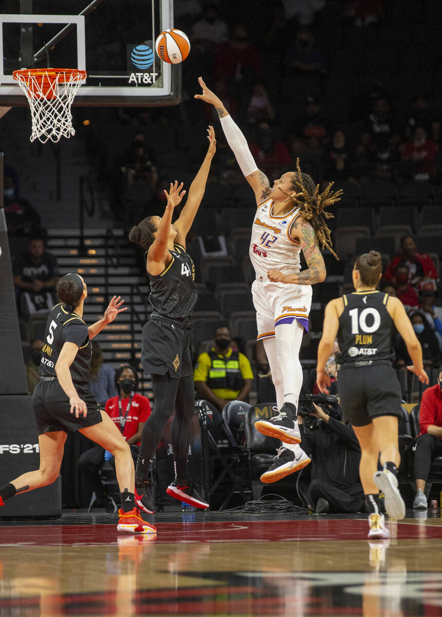 Phoenix Mercury center Brittney Griner (42) makes a shot over Las Vegas Aces center Kiah Stroke ...