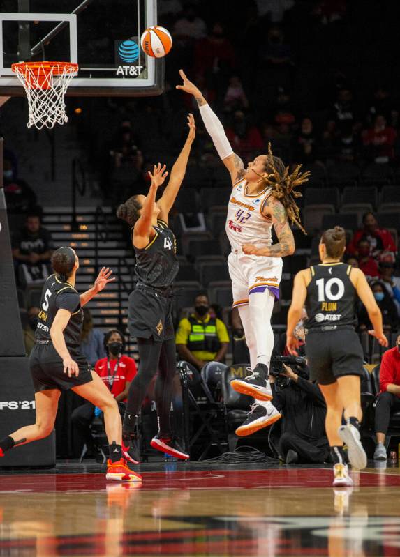 Phoenix Mercury center Brittney Griner (42) makes a shot over Las Vegas Aces center Kiah Stroke ...