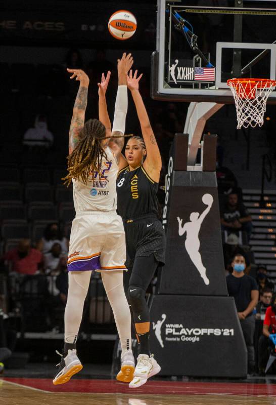 Las Vegas Aces center Liz Cambage (8) tries to block a shot by Phoenix Mercury center Brittney ...