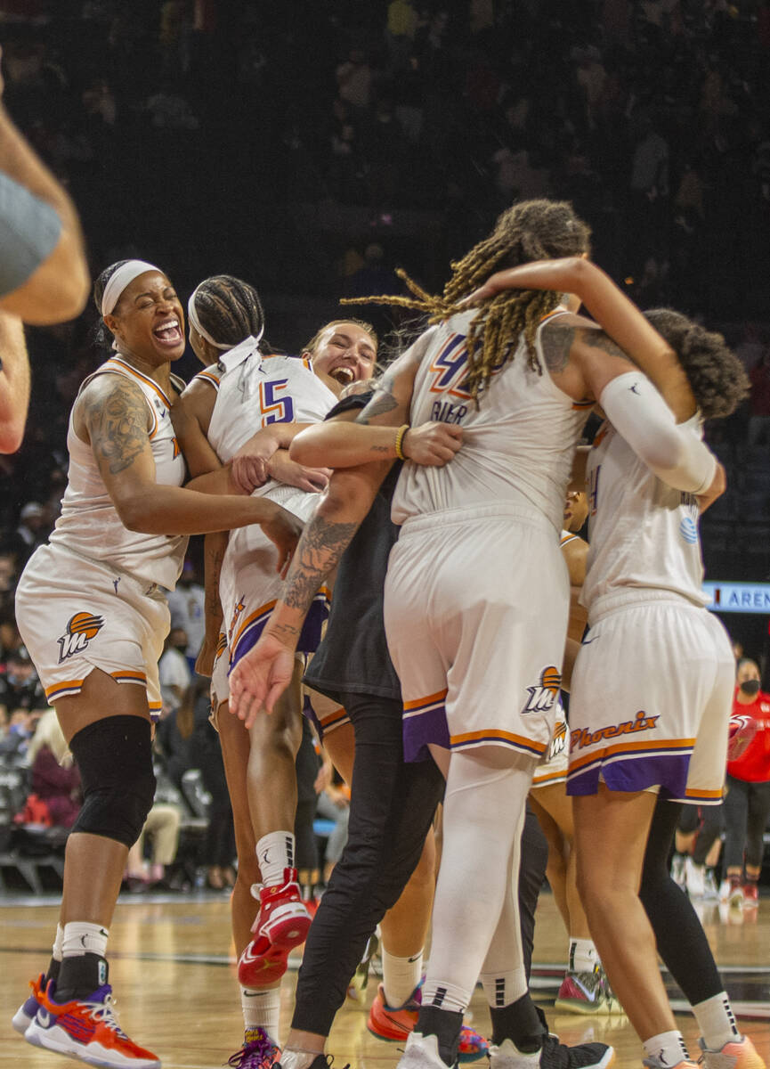 Phoenix Mercury players celebrate their Game 5 win over the Las Vegas Aces during a WNBA basket ...