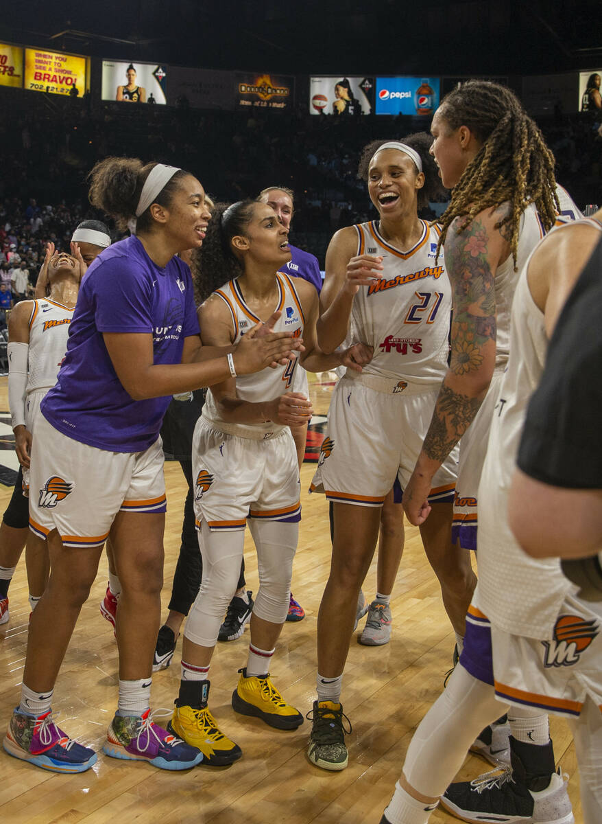 Phoenix Mercury players celebrate their Game 5 win over the Las Vegas Aces during a WNBA basket ...