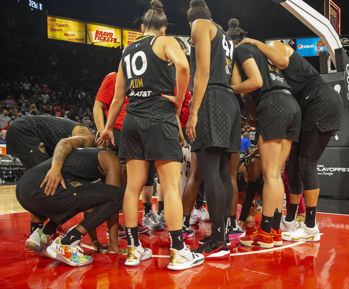 Las Vegas Aces players share an emotional moment at the Michelob Ultra Arena after losing Game ...