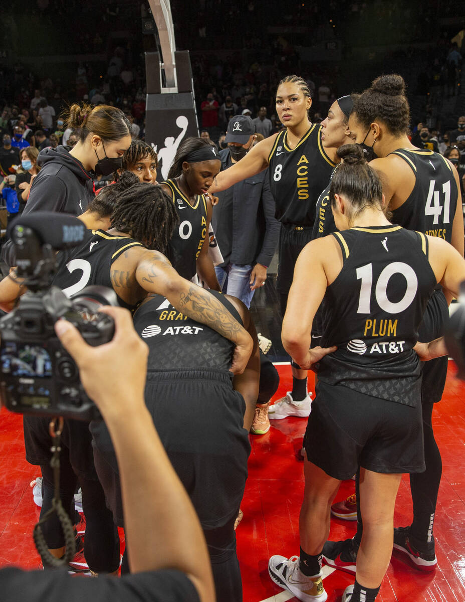 Las Vegas Aces players share an emotional moment at the Michelob Ultra Arena after losing Game ...