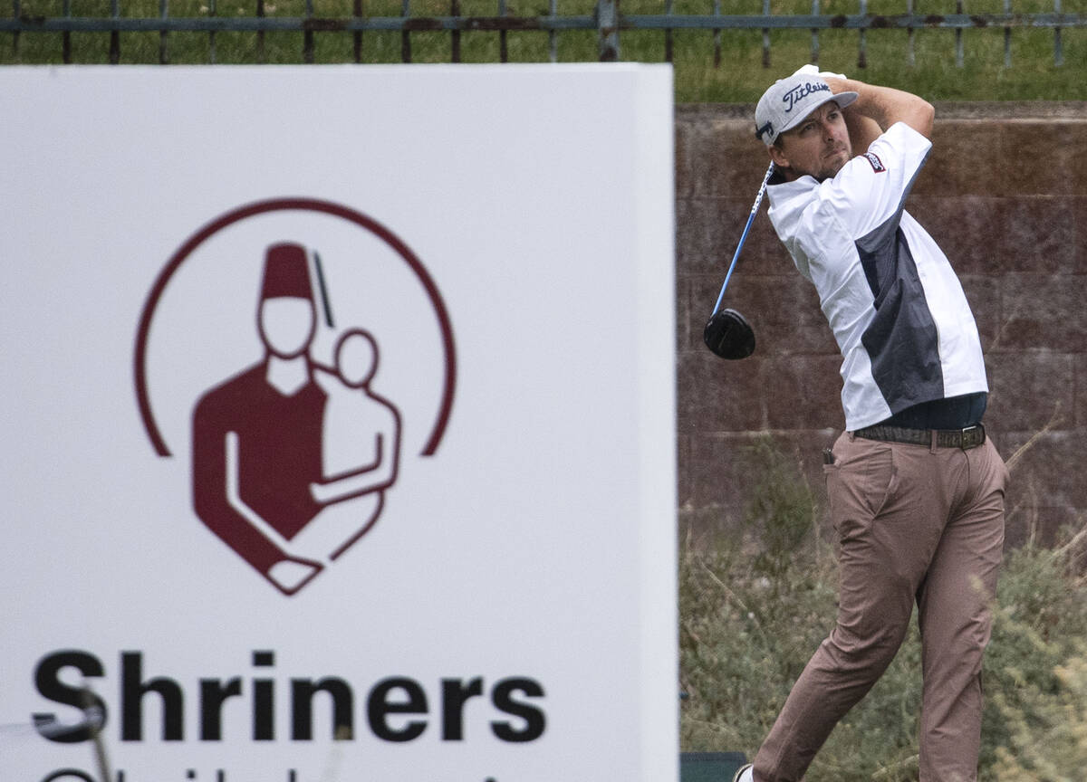 Roger Sloan of Canada watches his tee shot on the 10th hole during the second round of the Shri ...
