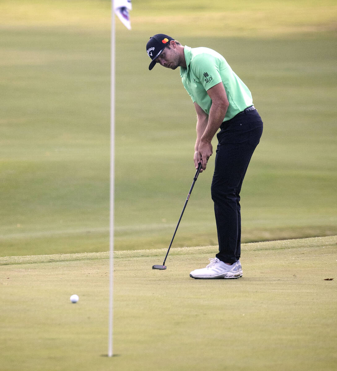 Sam Burns of Shreveport, La., makes his putt at the 18th hole during the second round of the Sh ...