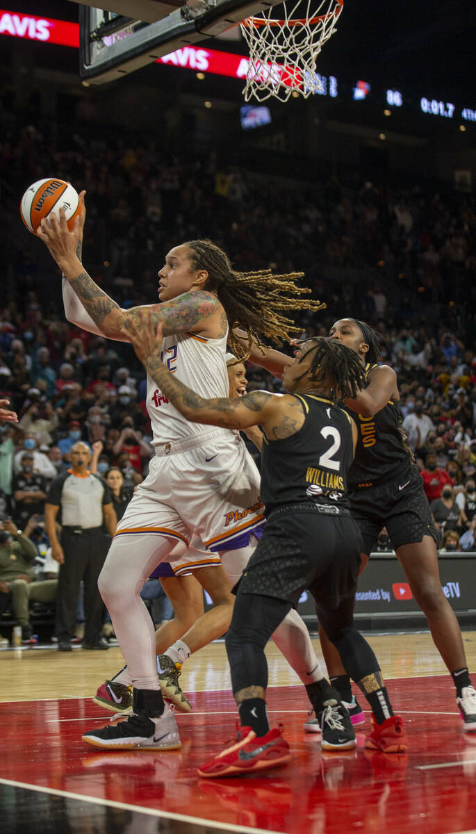 Phoenix Mercury center Brittney Griner (42) holds on to the basketball after swatting away a sh ...