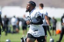 Raiders running back Peyton Barber (31) runs to practice warm ups at the Raiders Headquarters a ...