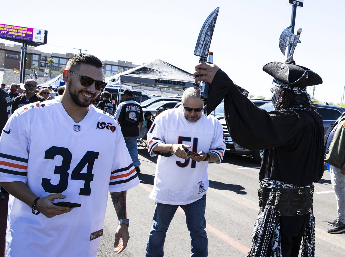 Chicago Bears fans Jordan Testa (34) and his father Richard both of Las Vegas walks past the Ra ...