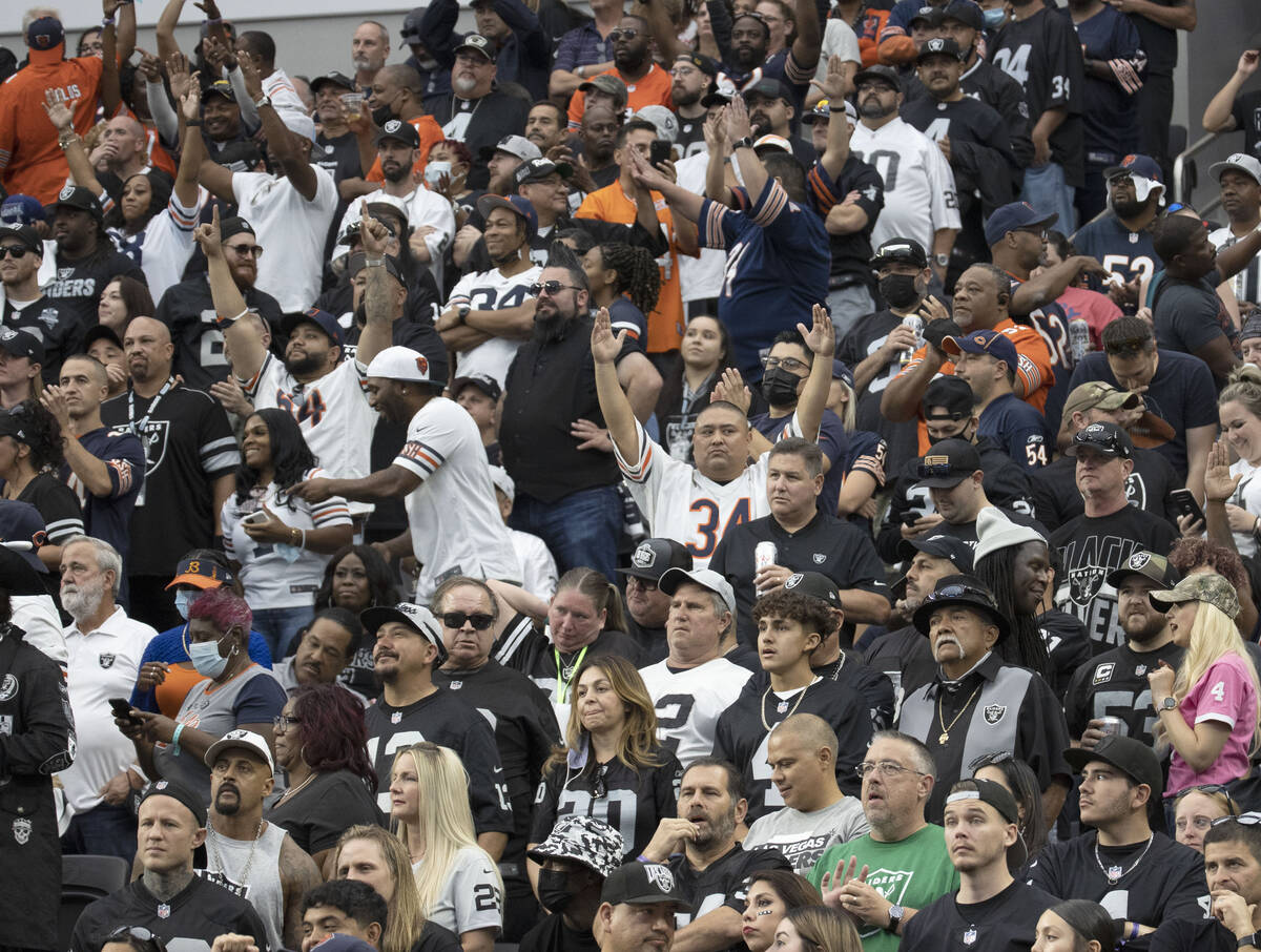 Chicago Bears fans cheer for their team during the second half of an NFL football game against ...