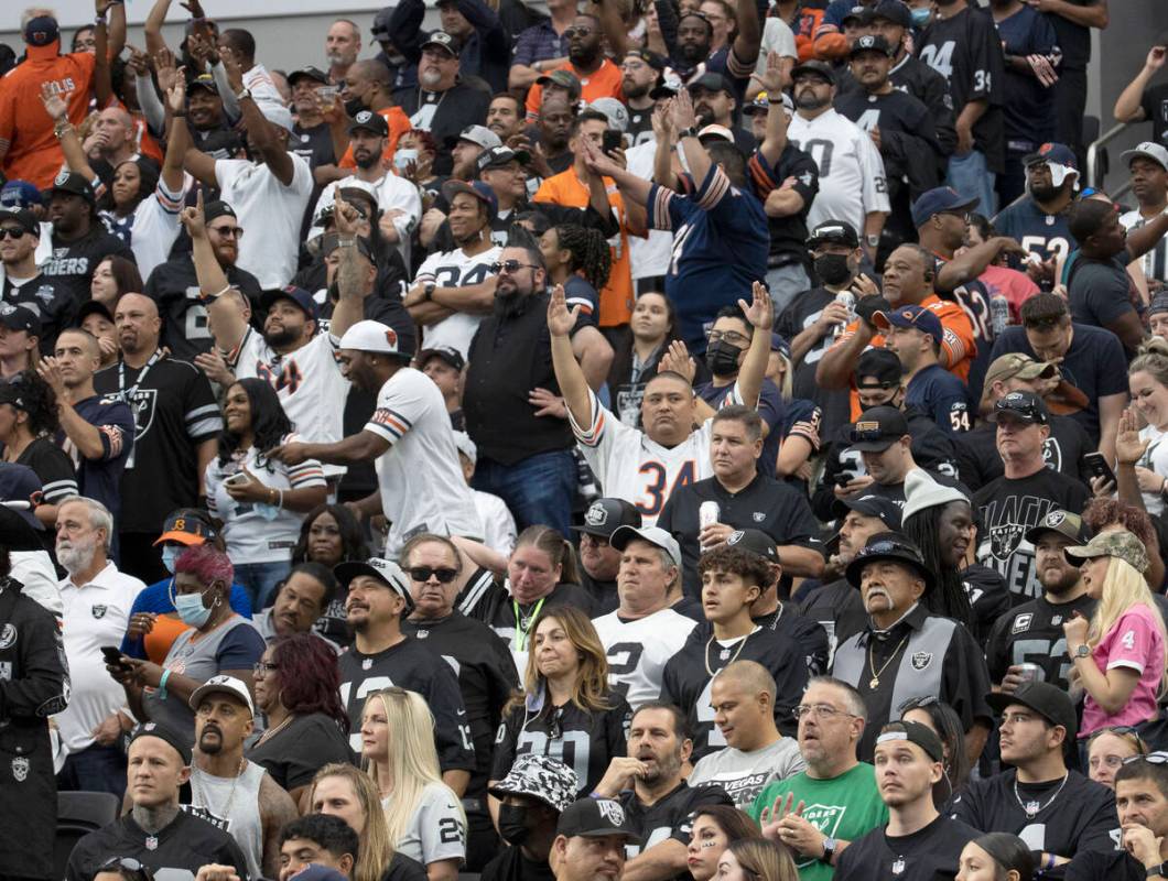 Chicago Bears fans cheer for their team during the second half of an NFL football game against ...