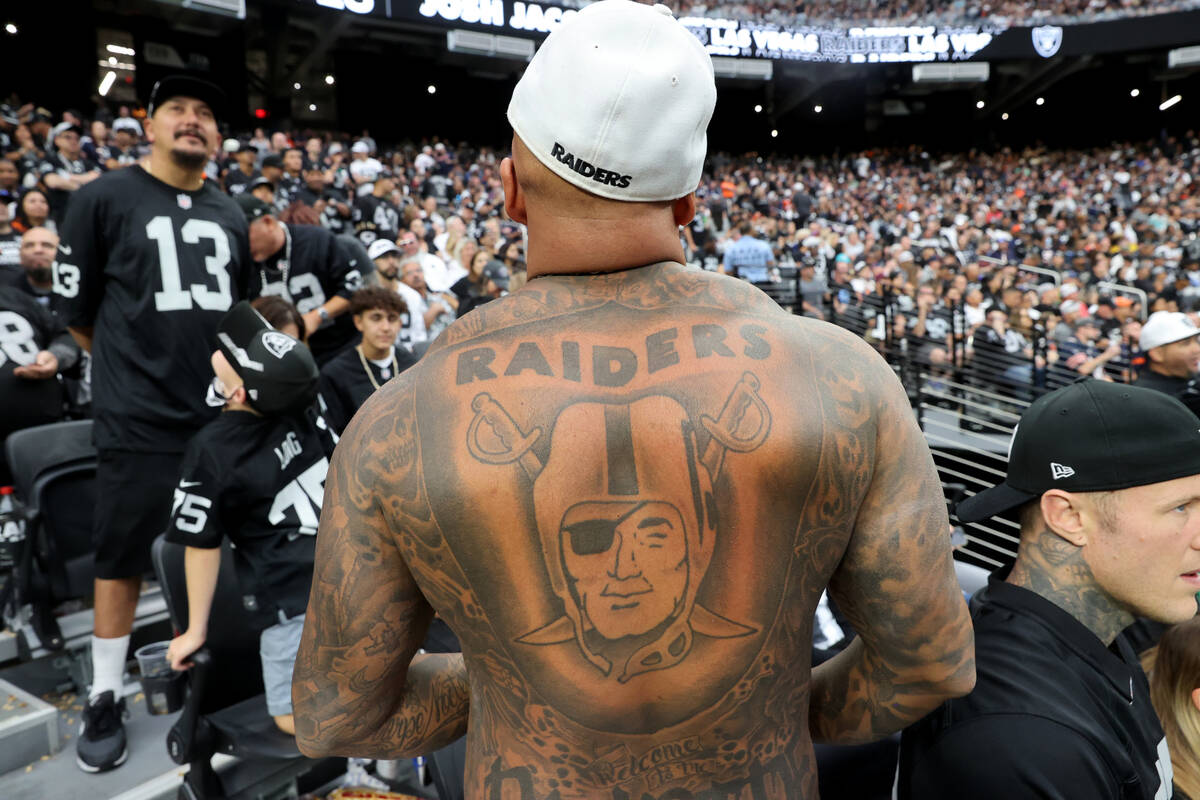 Gary Dhillon of Vancouver shows his Raiders tattoo as his team takes on the Chicago Bears at Al ...