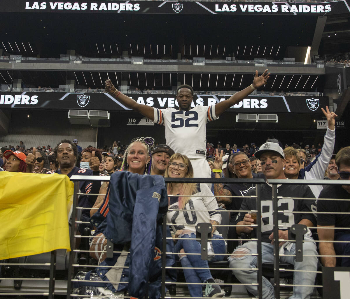 A Bears fan poses during the third quarter of an NFL football game against the Raiders on Sunda ...