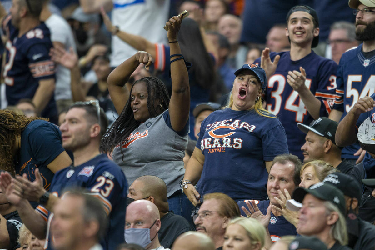 Chicago Bears fans cheer during the first quarter of an NFL football game against the Raiders o ...