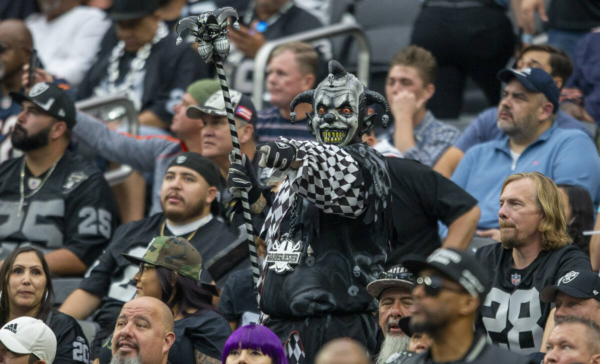 Raiders fan cheers during the third quarter of an NFL football game against the Chicago Bears o ...