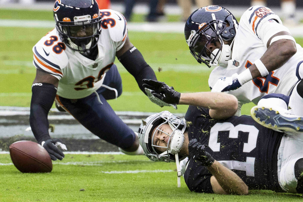 Raiders wide receiver Hunter Renfrow (13) tackled by Chicago Bears free safety Eddie Jackson (4 ...