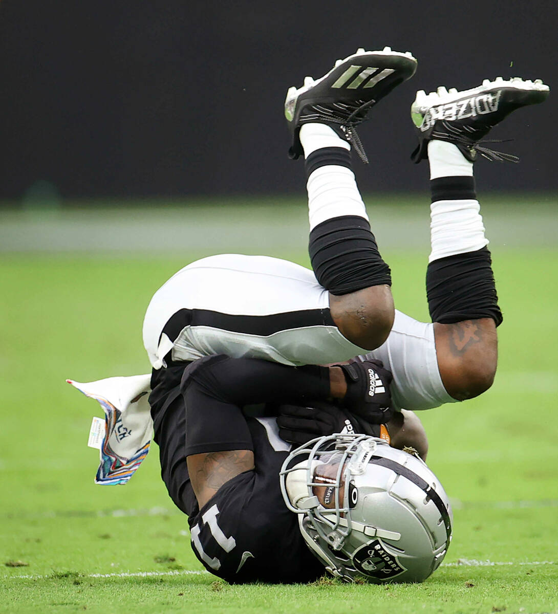 Raiders wide receiver Henry Ruggs III (11) makes a catch during the first half of an NFL footba ...
