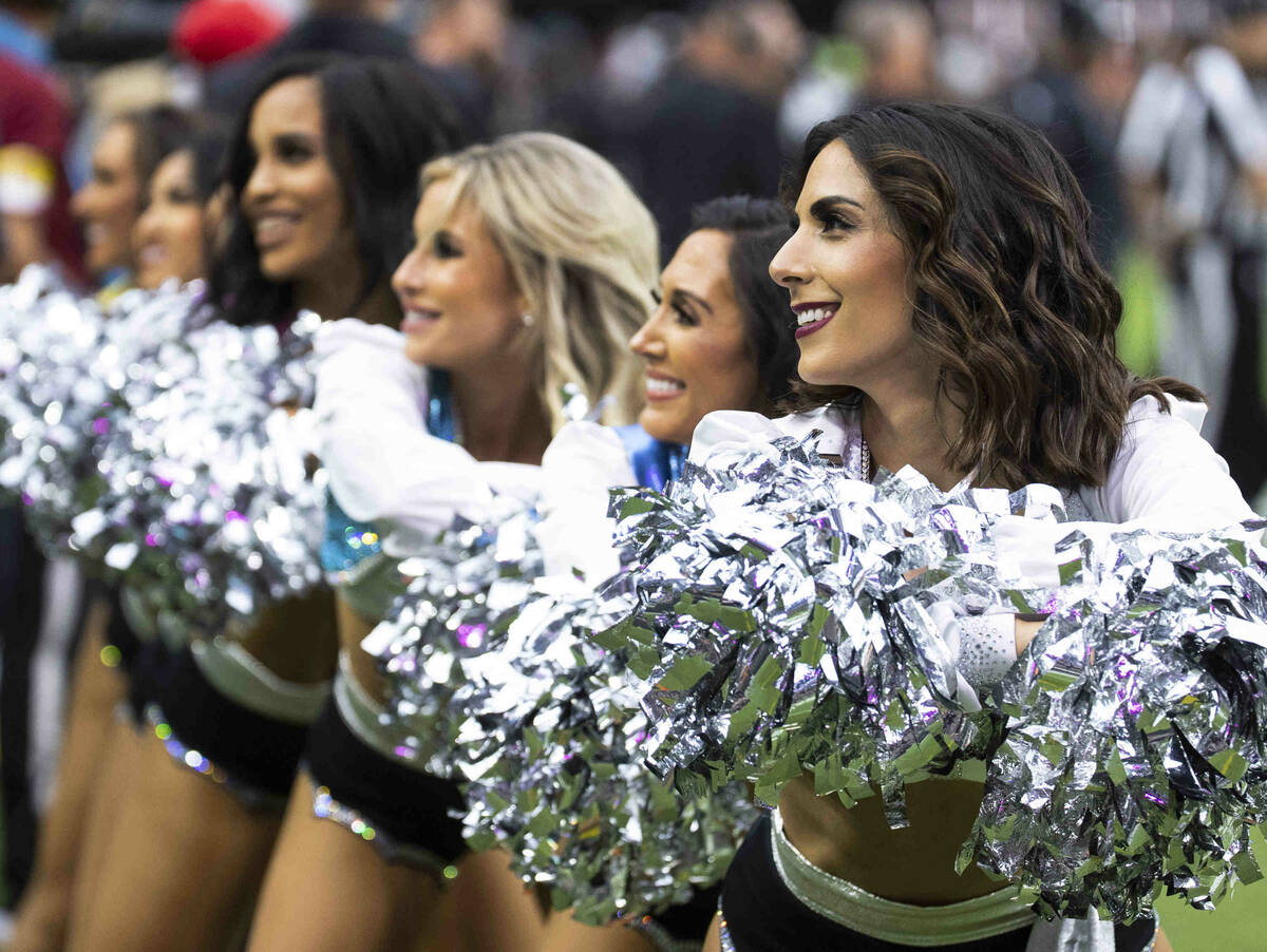 Raiders cheerleaders perform during an NFL football game against the Chicago Bears at Allegiant ...