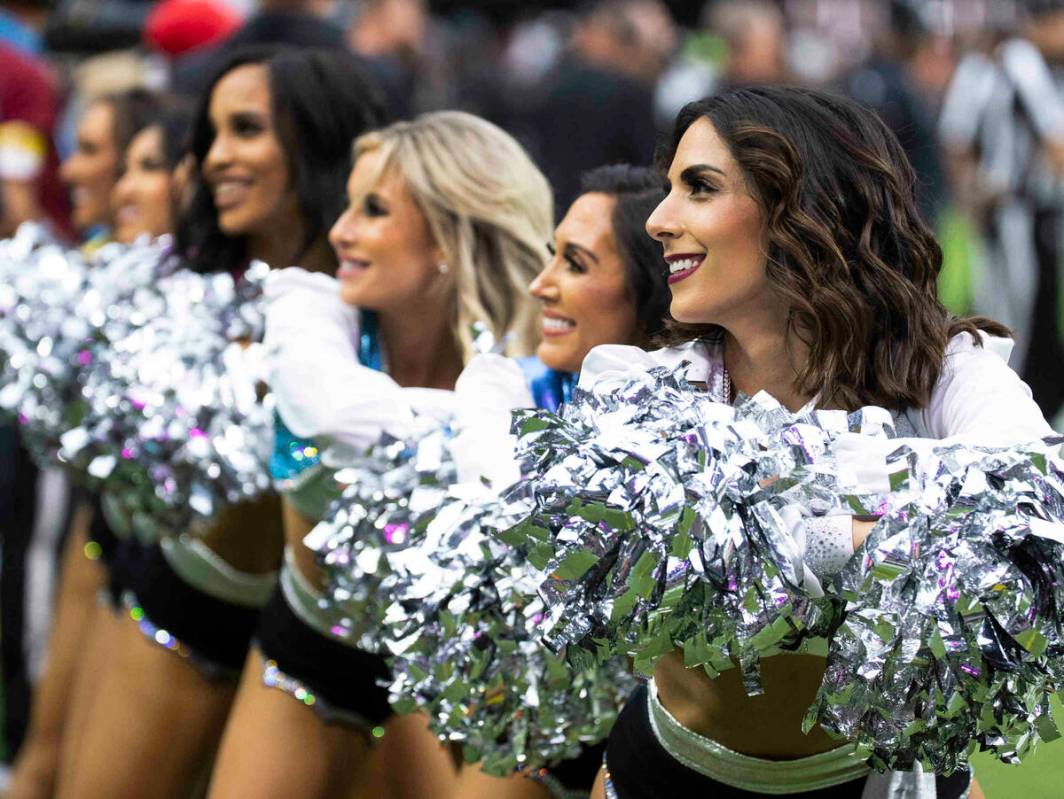 Raiders cheerleaders perform during an NFL football game against the Chicago Bears at Allegiant ...