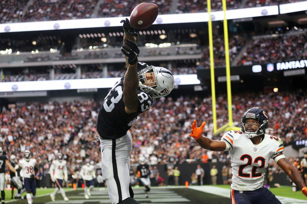 Raiders tight end Darren Waller (83) misses a ball for a touchdown under pressure from Chicago ...