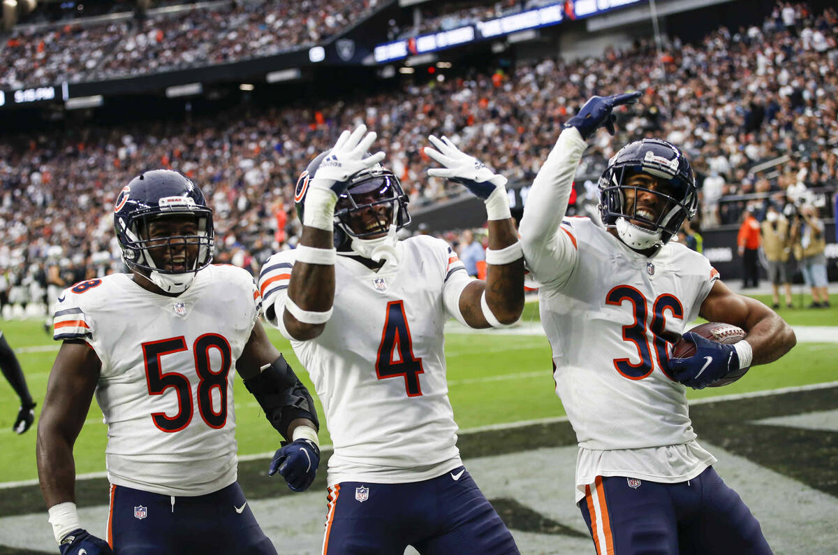 Chicago Bears defensive back DeAndre Houston-Carson (36) celebrates his interception with free ...