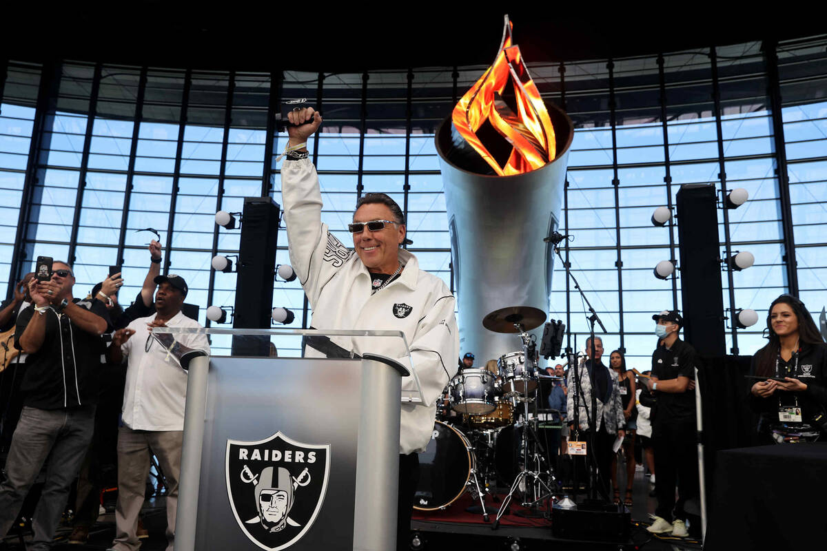 Las Vegas Labor Union Leader Tommy White lights the Al David Memorial Torch before the Raiders ...