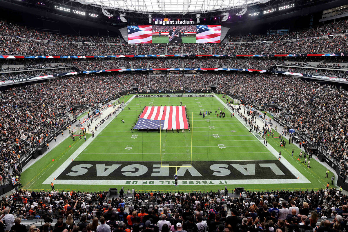 Neal Schon, founder of the band Journey, plays the National Anthem before the Raiders take on t ...