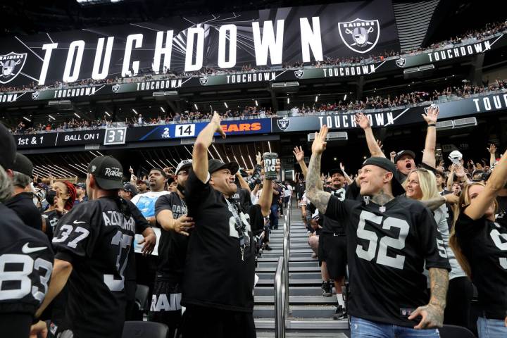 Fans, including Johnny Flores of Fontana, Calif., left, and Robert Pearlman of Newport Beach, c ...