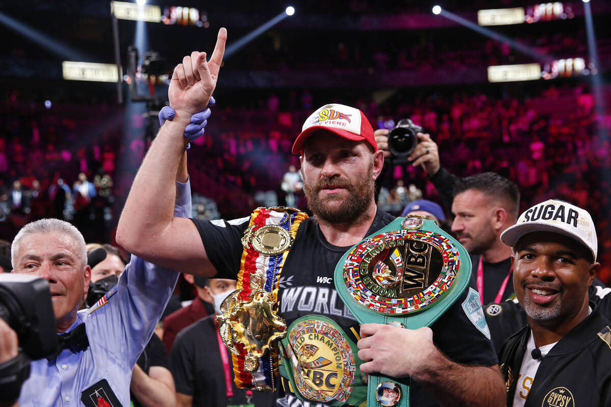Tyson Fury, of England, celebrates after defeating Deontay Wilder in a heavyweight championship ...