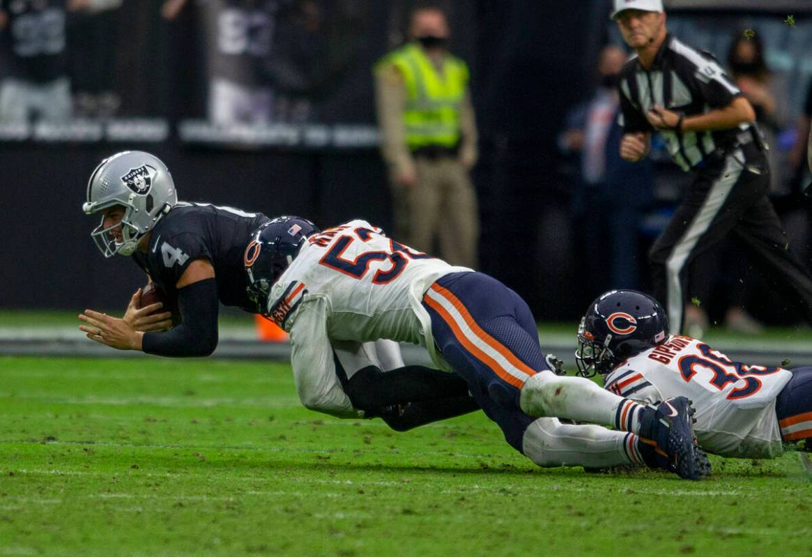 Chicago Bears outside linebacker Khalil Mack (52) sacks down Raiders quarterback Derek Carr (4) ...