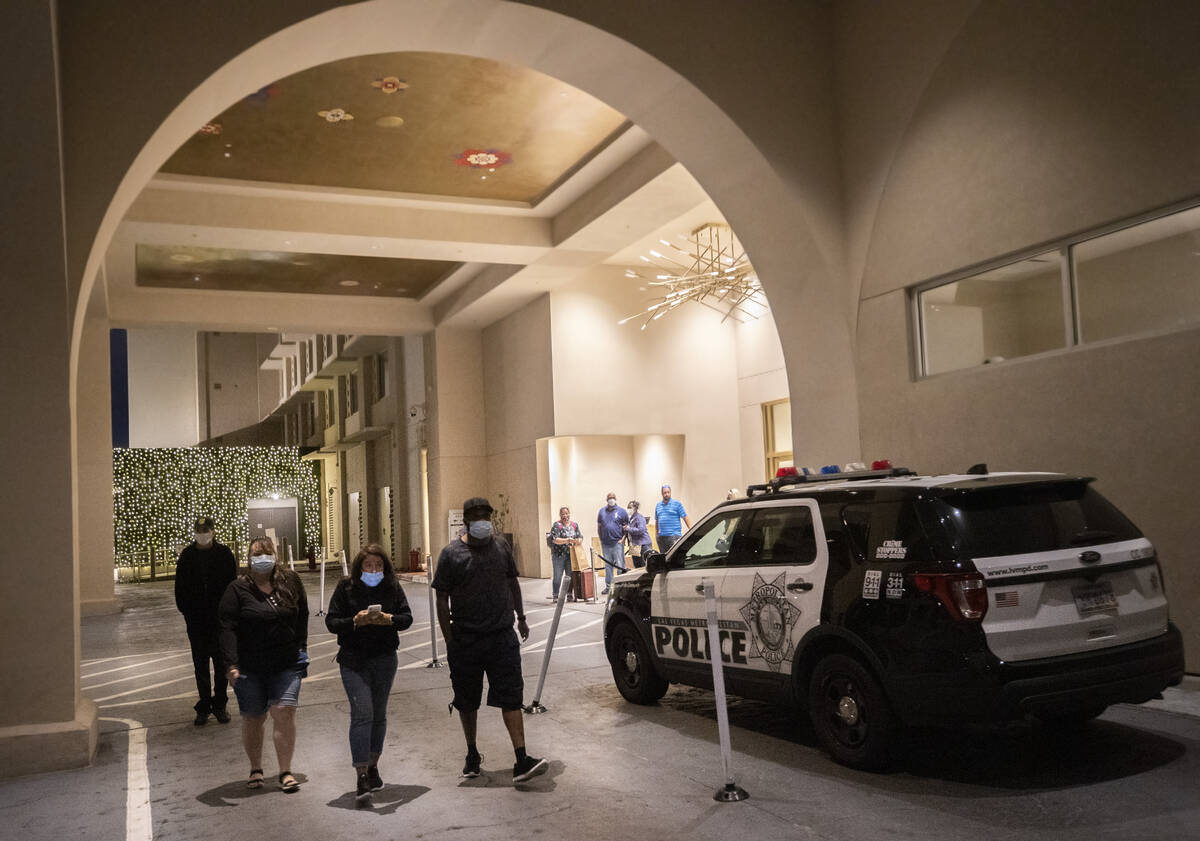 Guests pass Las Vegas Metro vehicles responding to a partial power outage at Sahara Las Vegas o ...