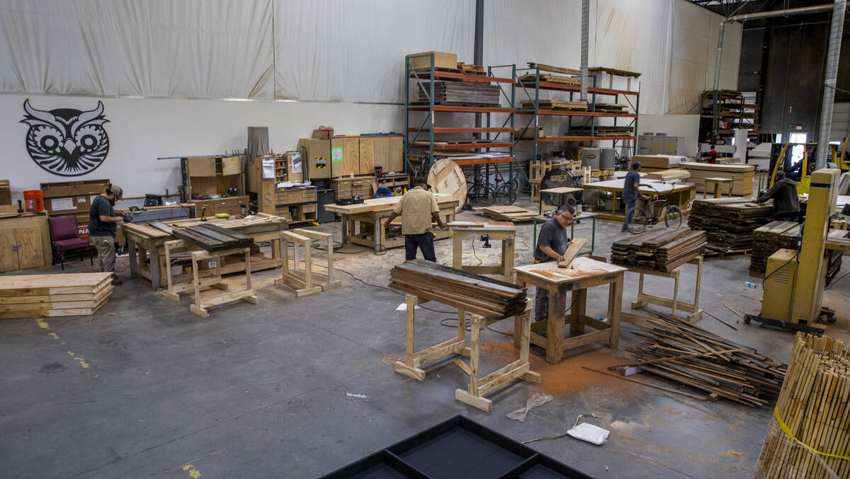 The wood shop is a hive of activity within the Electric Daisy Carnival warehouse on Thursday, S ...